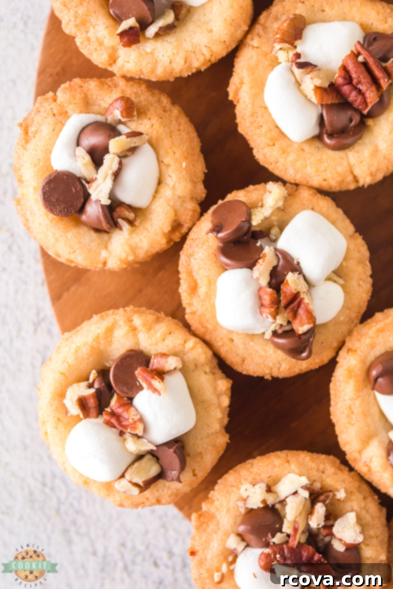 Decadent Rocky Road Cookie Cups 8 close up of rocky road cookie cups with chocolate chips, marshmallow and nuts