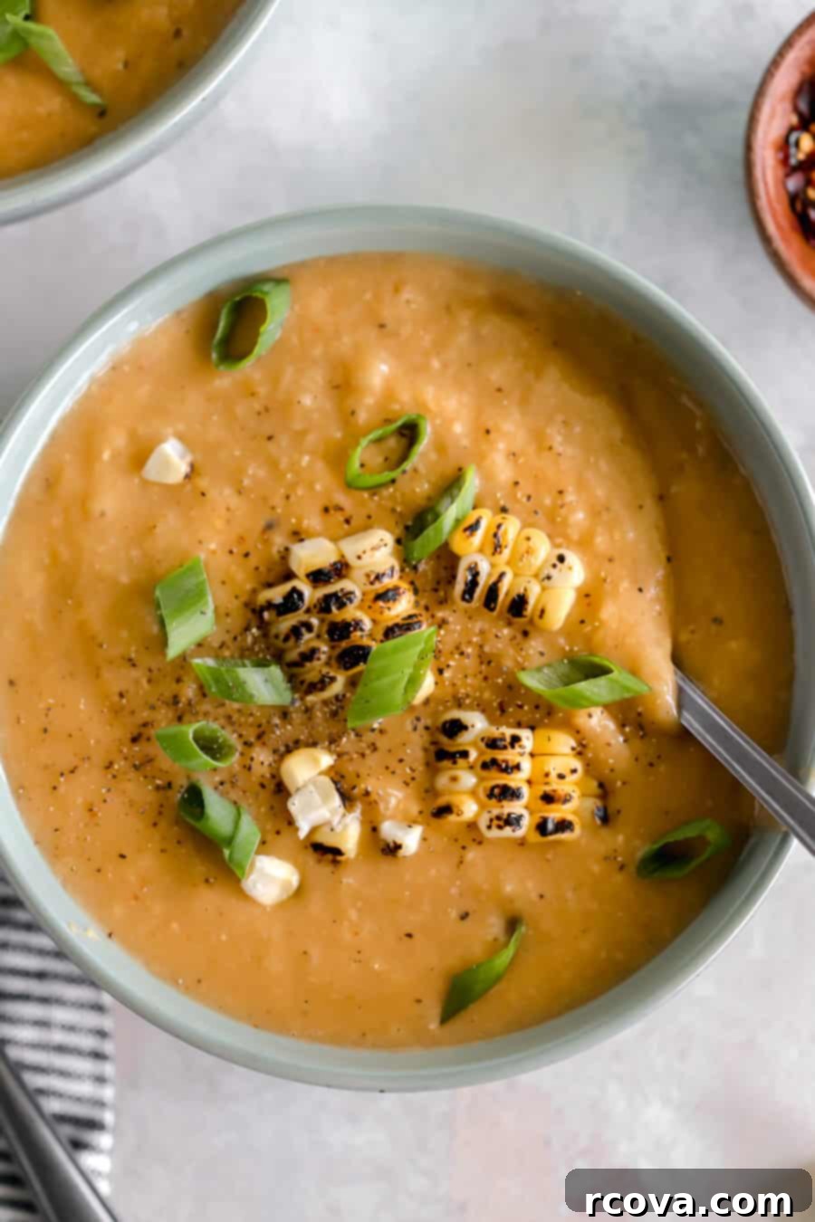 Speedy Smoky Chipotle Corn Cauliflower Chowder 3 Close-up of a vibrant bowl of Instant Pot Chipotle Corn and Cauliflower Chowder, showcasing its creamy texture and rich color, ready to be enjoyed