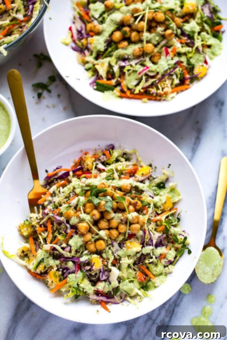 Energizing Chickpea Quinoa Salad 2 A colorful Chickpea Quinoa Power Salad with Jalapeno Dressing, showcasing a vegetarian rainbow slaw with diced mango and two-minute chili lime chickpeas, perfect for a healthy and satisfying meal.