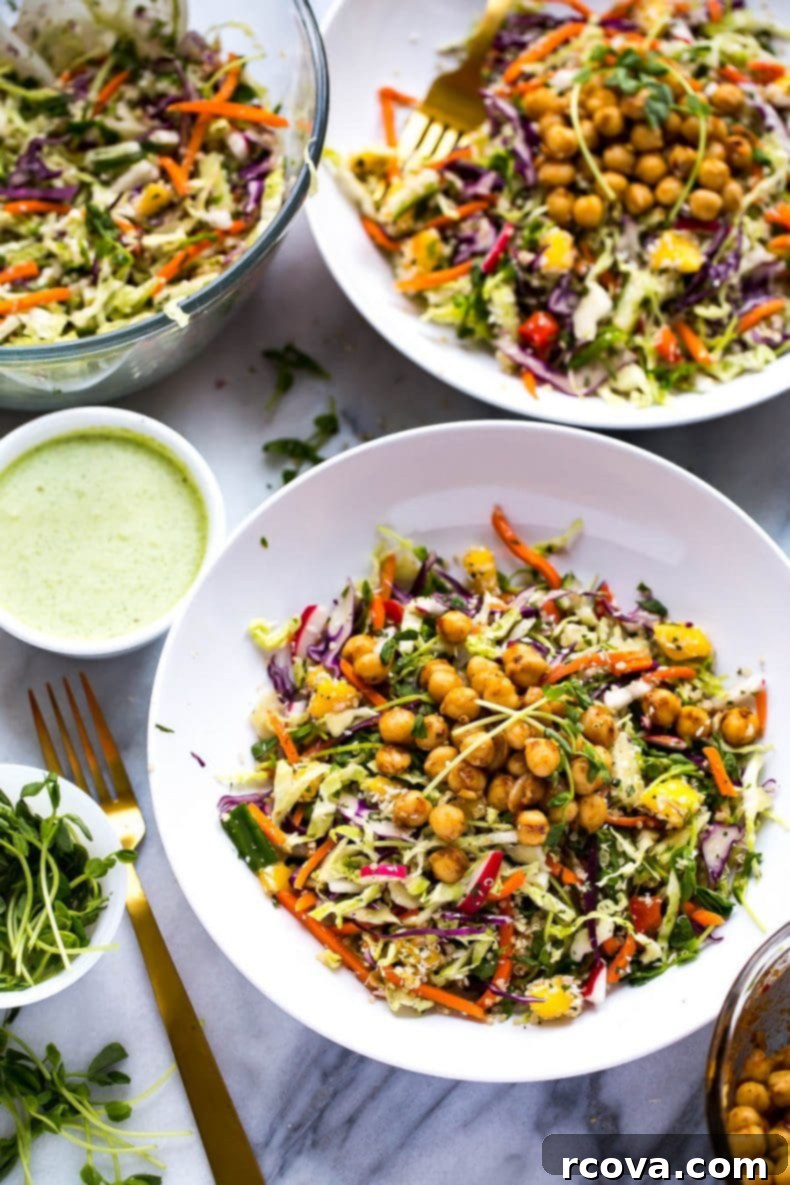 Energizing Chickpea Quinoa Salad 5 A vibrant and healthy Chickpea Quinoa Power Salad with Jalapeno Dressing, highlighting the colorful vegetarian slaw, sweet diced mango, and the seasoned chili lime chickpeas, ready for a delicious meal.