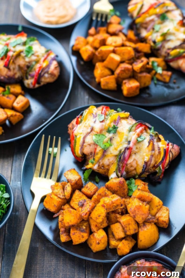 Hasselback Fiesta Chicken with Smoky Fajita Filling 4 Close-up of Hasselback Fajita Stuffed Chicken baking in the oven, showing vibrant peppers and cheese
