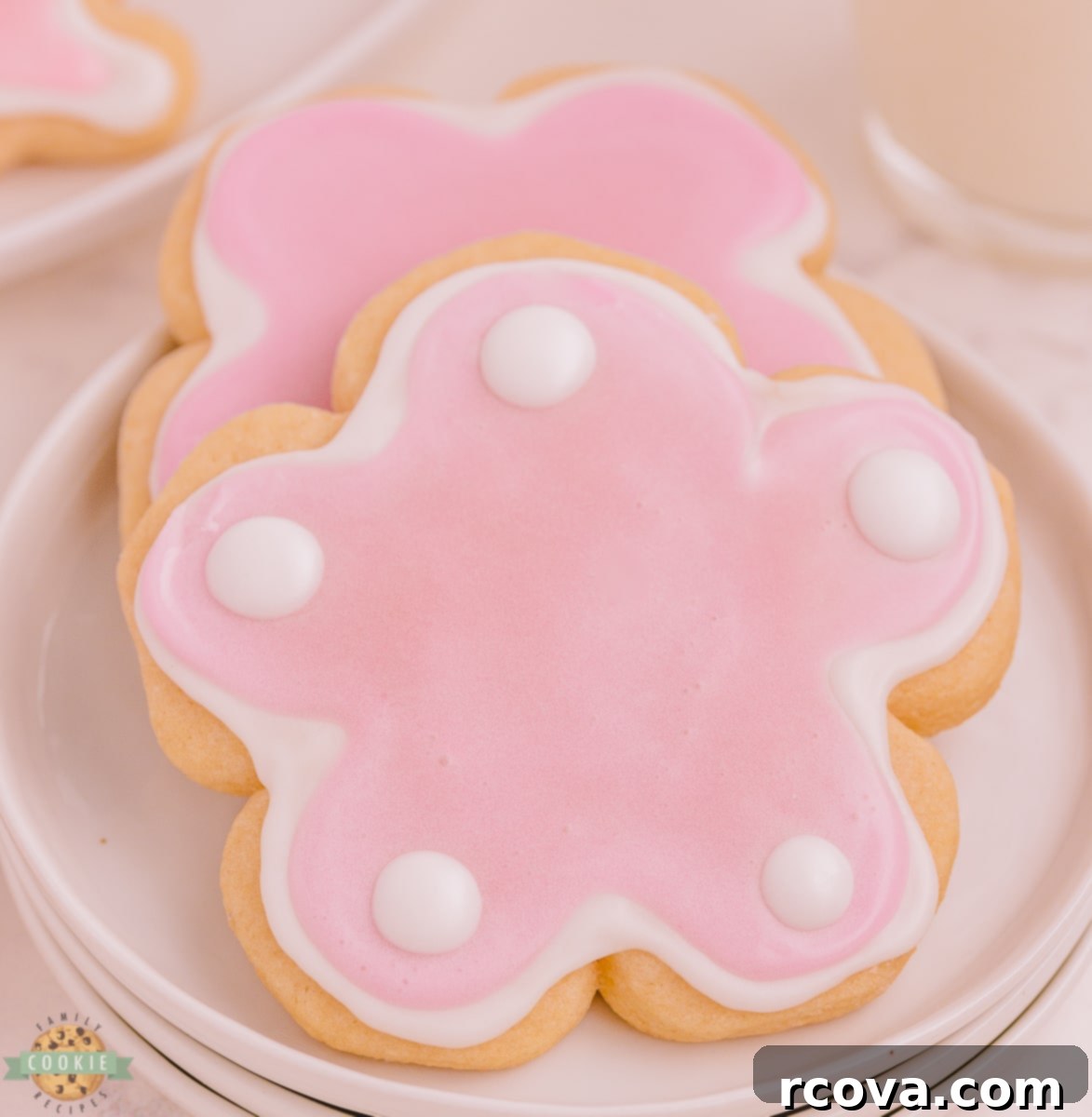 Zesty Lemon Shaped Sugar Cookies 4 Pink flower sugar cookies iced with homemade royal icing, showcasing spring colors