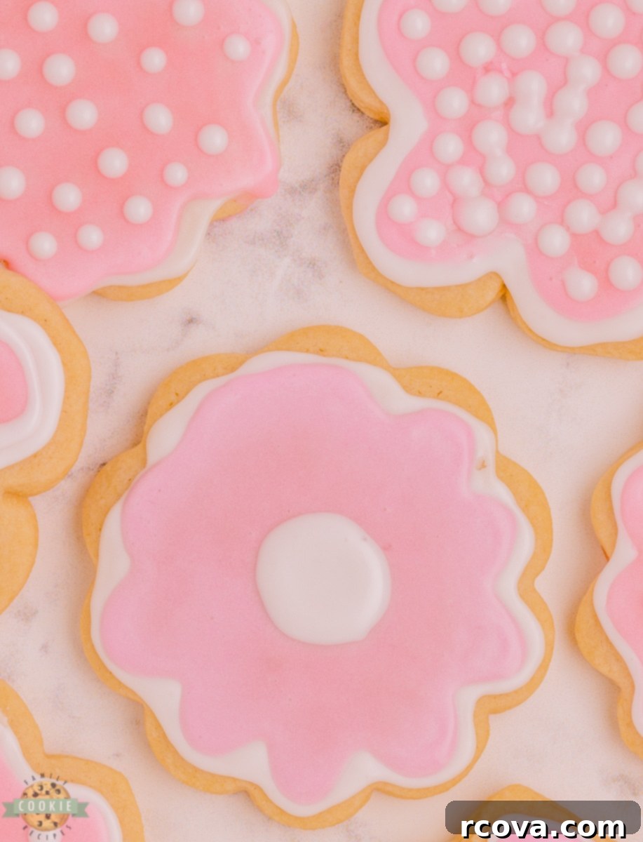 Zesty Lemon Shaped Sugar Cookies 6 Simple pink flower sugar cookies with white and pink royal icing