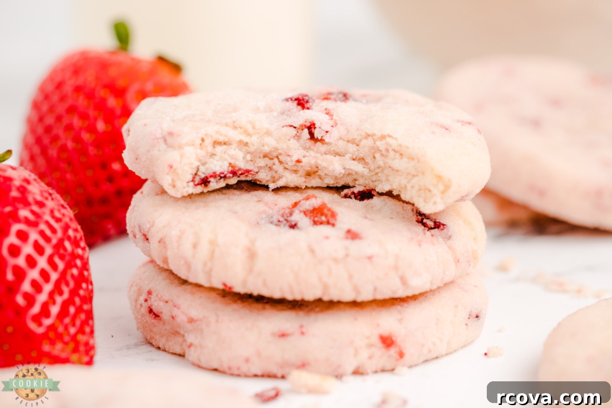 Luscious Strawberry Cream Cheese Sugar Cookies 3 A perfectly baked strawberry cream cheese sugar cookie with a bite taken out, showing its tender interior