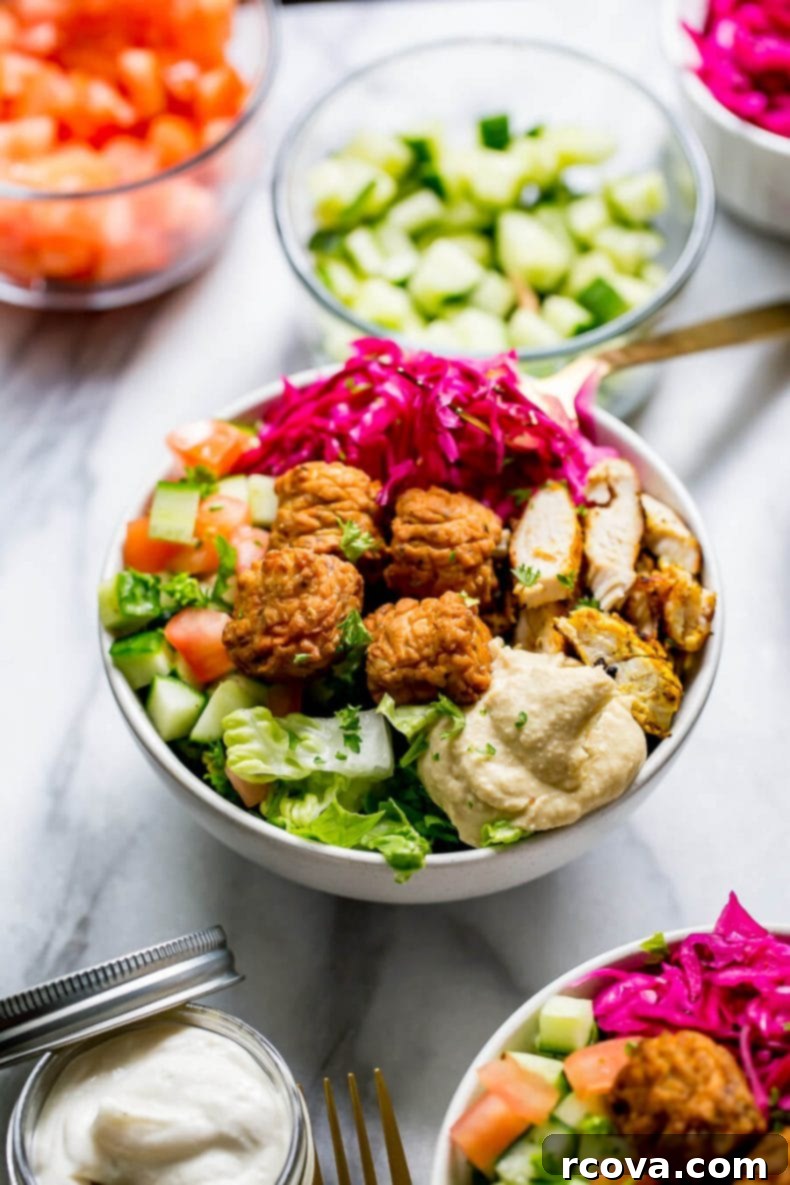 Mediterranean Chicken Falafel Bowls 5 Plated Chicken Falafel Buddha Bowls with vibrant toppings
