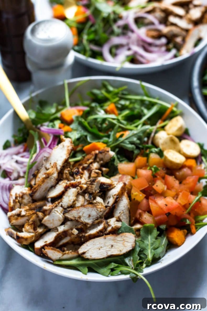 Chargrilled Chicken and Peppery Arugula Salad 5 A vibrant bowl of Balsamic Grilled Chicken and Arugula Salad, showcasing all fresh ingredients and sliced chicken