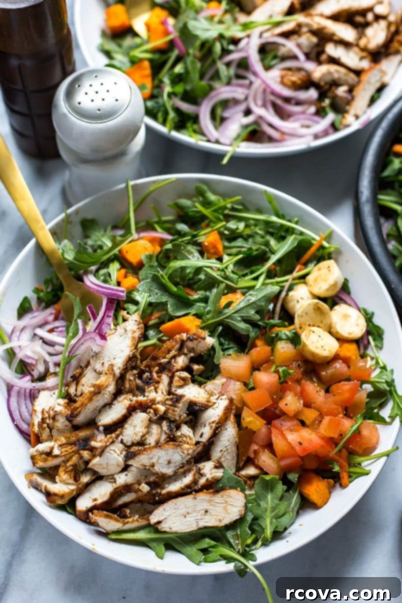 Chargrilled Chicken and Peppery Arugula Salad 7 Close-up of the delicious Balsamic Grilled Chicken and Arugula Salad in a bowl, with a fork ready to dig in.