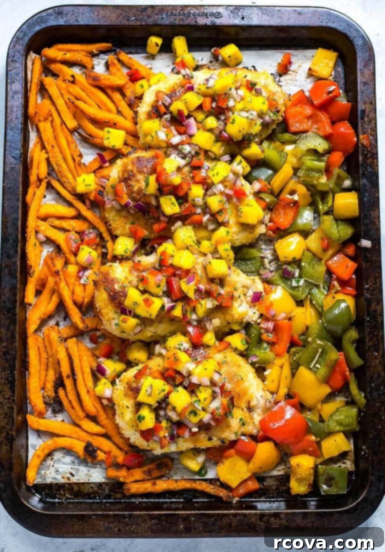 Golden Crispy Coconut Chicken Sheet Pan Dinner 2 Sheet Pan Coconut Crusted Chicken - Golden brown coconut chicken cutlets next to vibrant bell peppers and sweet potato fries.