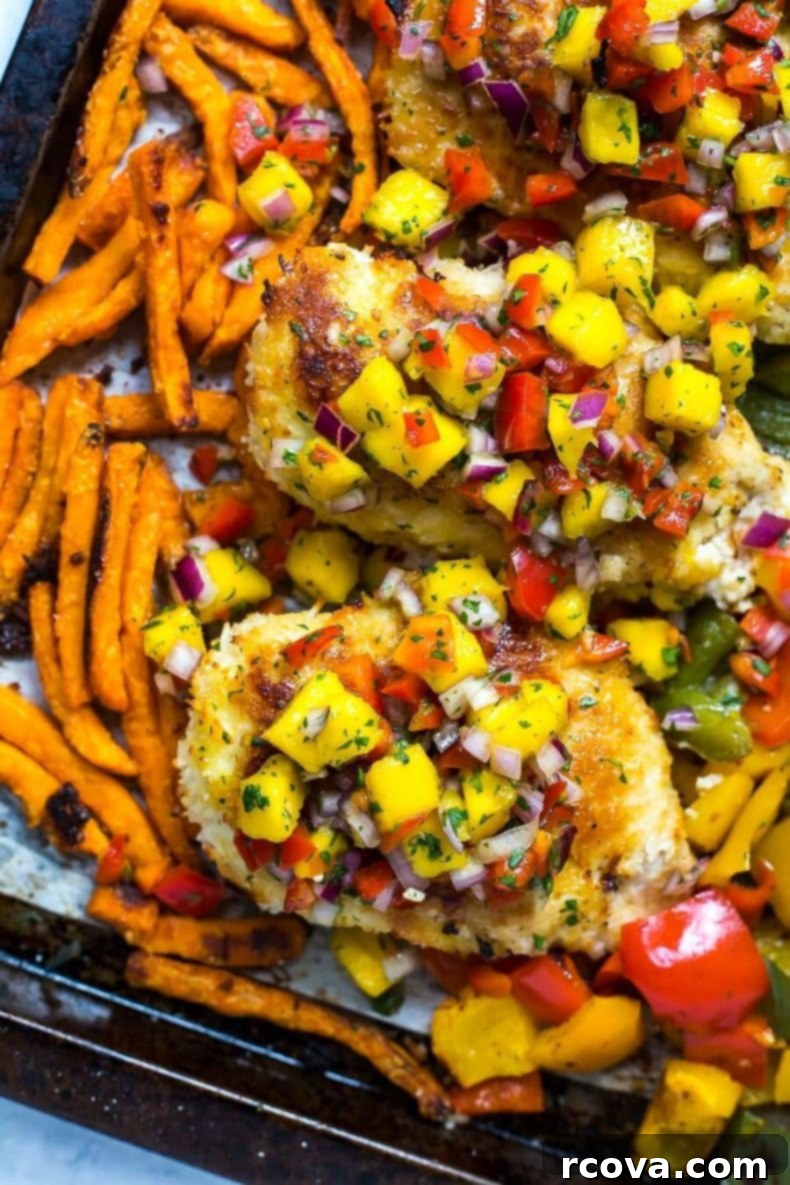 Golden Crispy Coconut Chicken Sheet Pan Dinner 5 Sheet Pan Coconut Crusted Chicken on a baking sheet, fresh out of the oven.