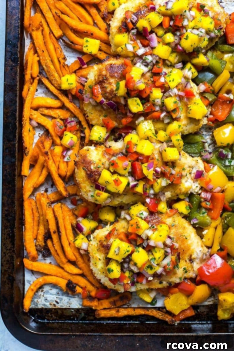 Golden Crispy Coconut Chicken Sheet Pan Dinner 6 A bowl of fresh mango salsa, vibrant and colorful.