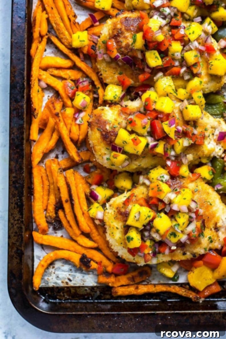 Golden Crispy Coconut Chicken Sheet Pan Dinner 8 Sheet Pan Crispy Coconut Chicken ready for serving with fresh mango salsa.