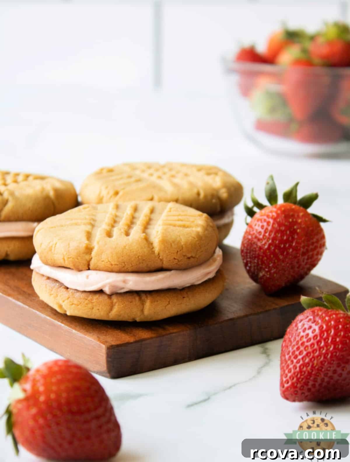 PB&J Cookie Delights 3 Peanut butter cookie sandwich with strawberry buttercream in the middle