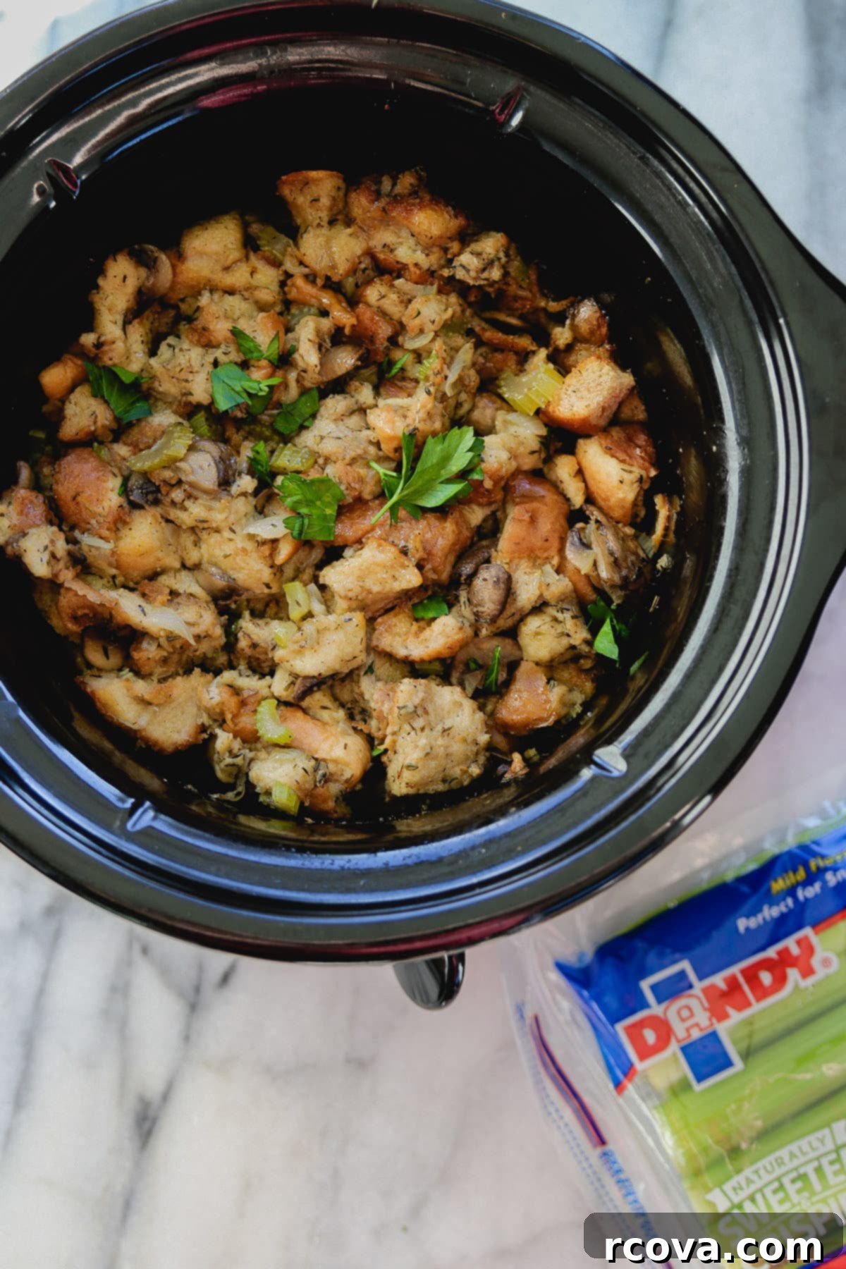 Stress-Free Slow Cooker Mushroom Stuffing 2 Slow Cooker Mushroom and Herb Stuffing, cooked and ready to serve in a slow cooker pot.