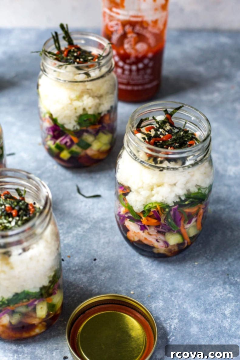 Meal Prep Dynamite Shrimp Sushi Jars 6 Various Dynamite Shrimp Sushi Jars in different stages of preparation