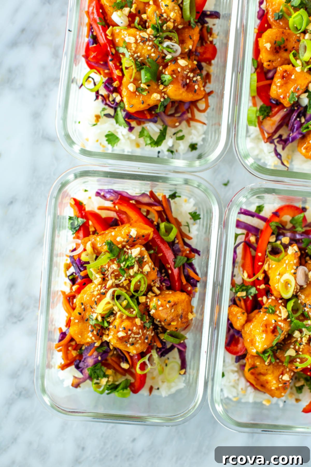Grab-and-Go Sweet Chili Chicken Bowls 9 Four perfectly prepared sweet chili chicken meal prep containers, neatly arranged and ready for a week of healthy and convenient lunches.
