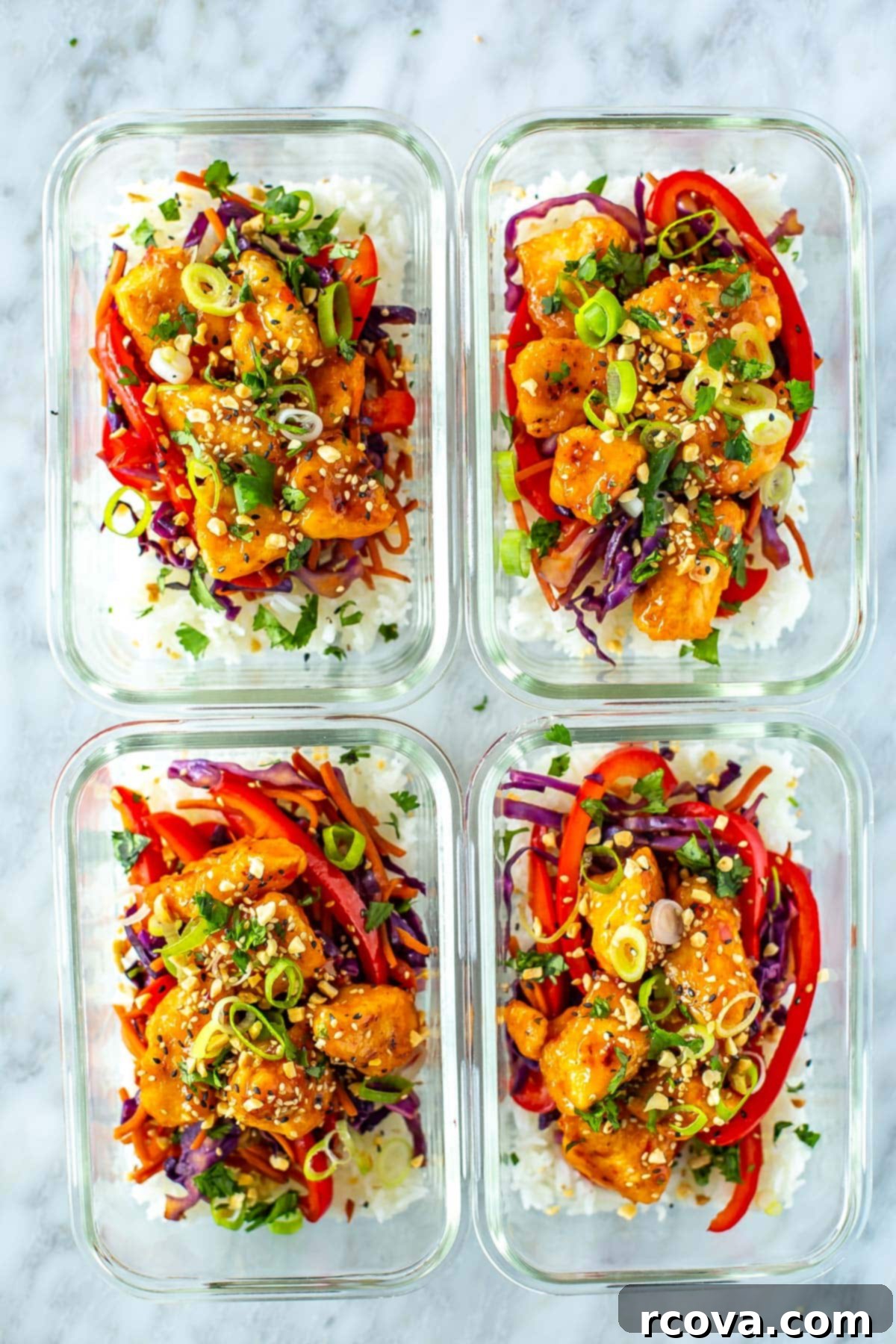 Grab-and-Go Sweet Chili Chicken Bowls 10 A top-down view of four organized meal prep containers, each holding a vibrant serving of sweet chili chicken, jasmine rice, and colorful vegetables, highlighting their convenience for weekly planning.