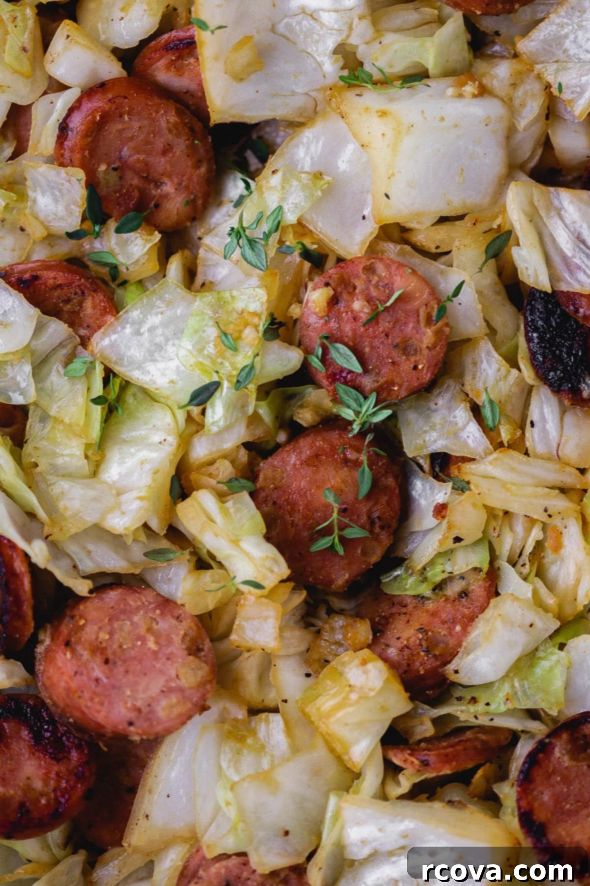 Easy Skillet Chicken Sausage and Cabbage 5 Close-up of perfectly browned chicken sausage in a skillet.