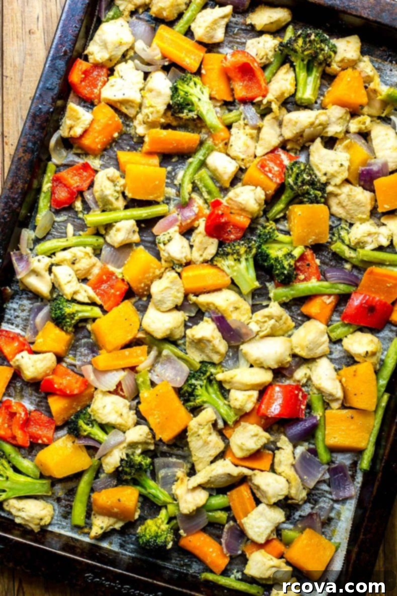 Simple Golden Honey Dijon Sheet Pan Chicken 6 Close up of perfectly roasted sheet pan honey dijon chicken and vegetables.