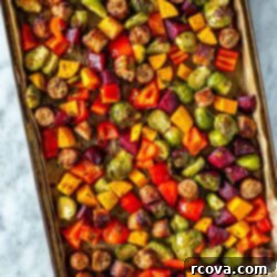 Sheet Pan Roasted Sausage and Vegetables 10 A sheet pan with sausage and vegetables, ready to be cooked.