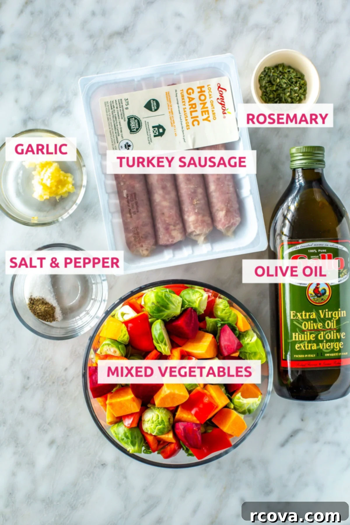 Sheet Pan Roasted Sausage and Vegetables 4 Ingredients for sheet pan sausage and vegetables: a colorful assortment of mixed root vegetables like sweet potato, Brussels sprouts, beets, and red pepper, alongside turkey sausage, olive oil, fresh rosemary, minced garlic, salt, and pepper.