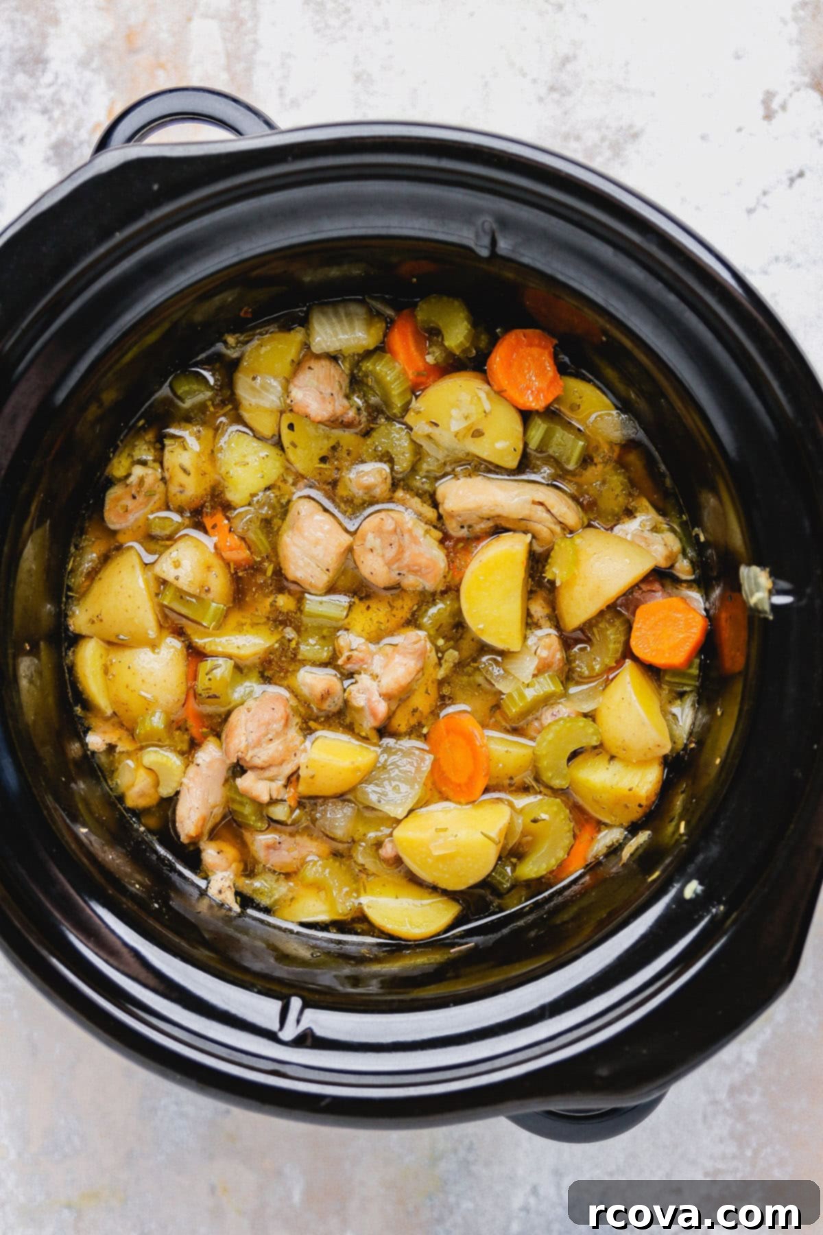 Set It and Forget It Gluten Free Dairy Free Slow Cooker Chicken Stew 6 All ingredients (except slurry) added to a slow cooker, ready to cook.