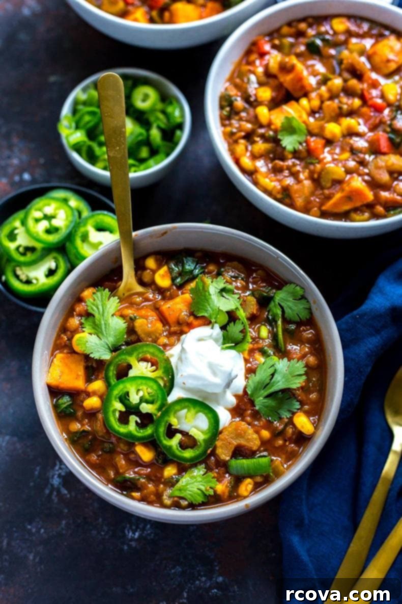 Hearty Slow Cooker Vegetarian Lentil Chili 6 A large pot of Slow Cooker Sweet Potato Lentil Chili simmering, ready to be served.