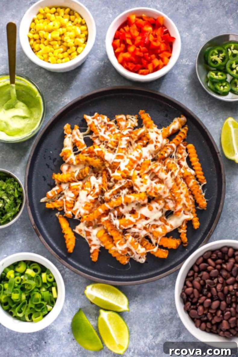 Easy Tex-Mex Sweet Potato Nacho Fries 5 Overhead shot of freshly baked Easy Loaded Tex Mex Sweet Potato Fries ready to be served.