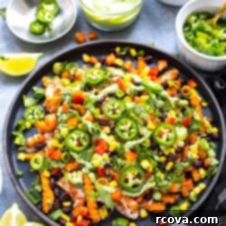 Easy Tex-Mex Sweet Potato Nacho Fries 9 Easy Loaded Tex Mex Sweet Potato Fries, visually appealing with fresh ingredients.