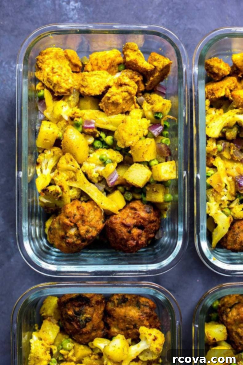 Spice Route Chicken Meal Prep 5 Plated Indian Chicken Meal Prep Bowl with Pakoras and Cilantro Garnish