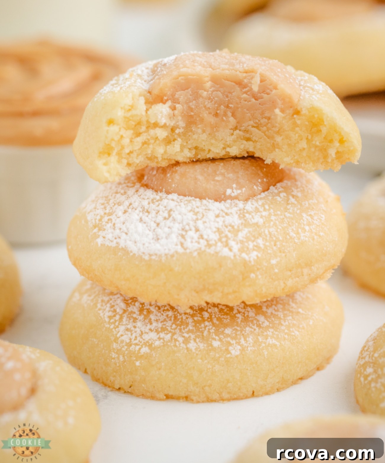 Peanut Butter Thumbprint Delights 2 peanut butter thumbprint cookie with a bite taken out