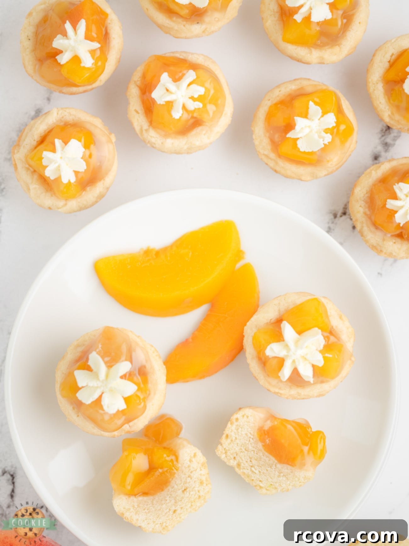 Peachy Dream Cookies 5 Freshly baked peach pie cookies in a muffin tin, showing the indents for filling.