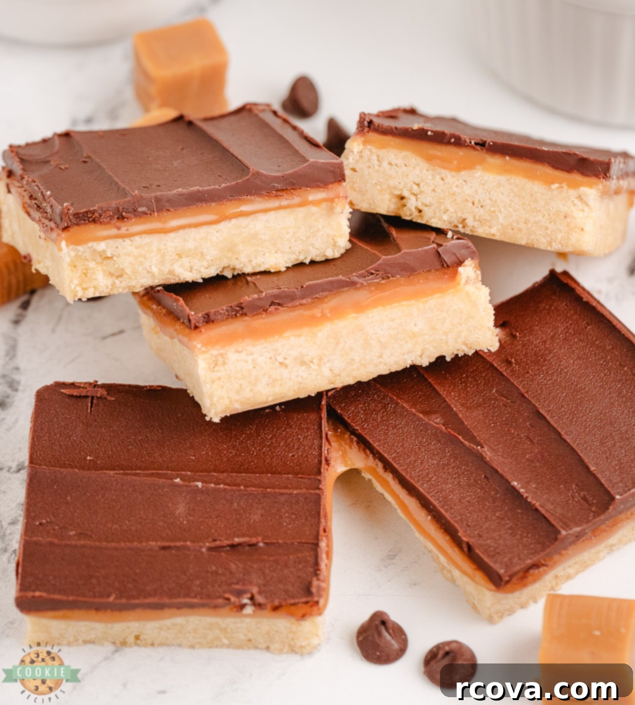 Chocolate Caramel Shortbread Bliss 3 Close-up of golden shortbread cookie squares, freshly baked and ready for the caramel and chocolate layers to be added
