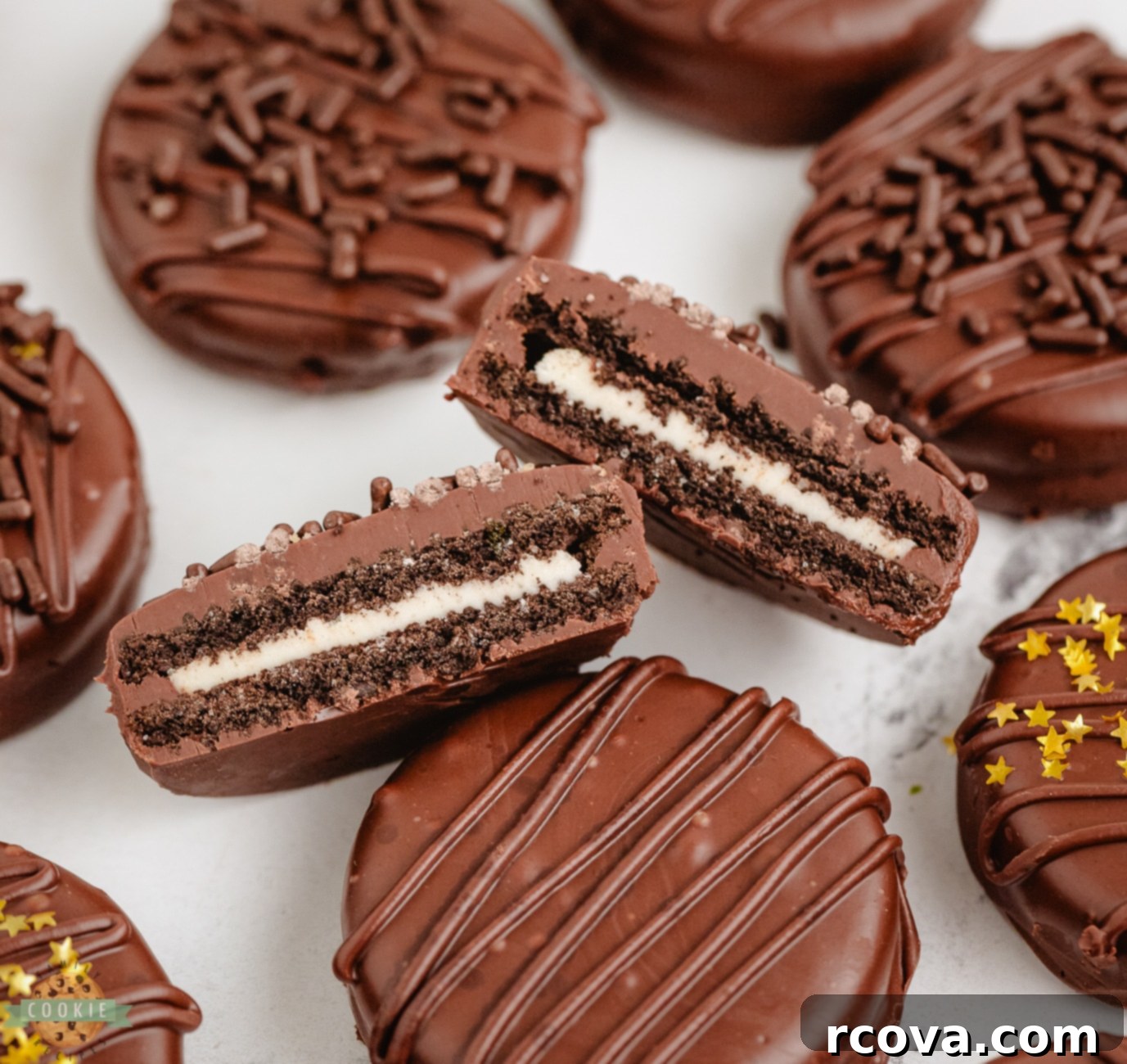 Decadent Chocolate Dipped Oreos 8 A chocolate dipped Oreo cookie cut in half, showing the cream filling