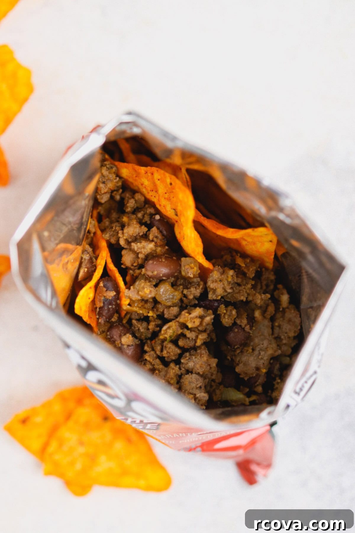 Kick Off Your Football Party With Ultimate Walking Tacos 4 taco meat scooped over Doritos for walking tacos