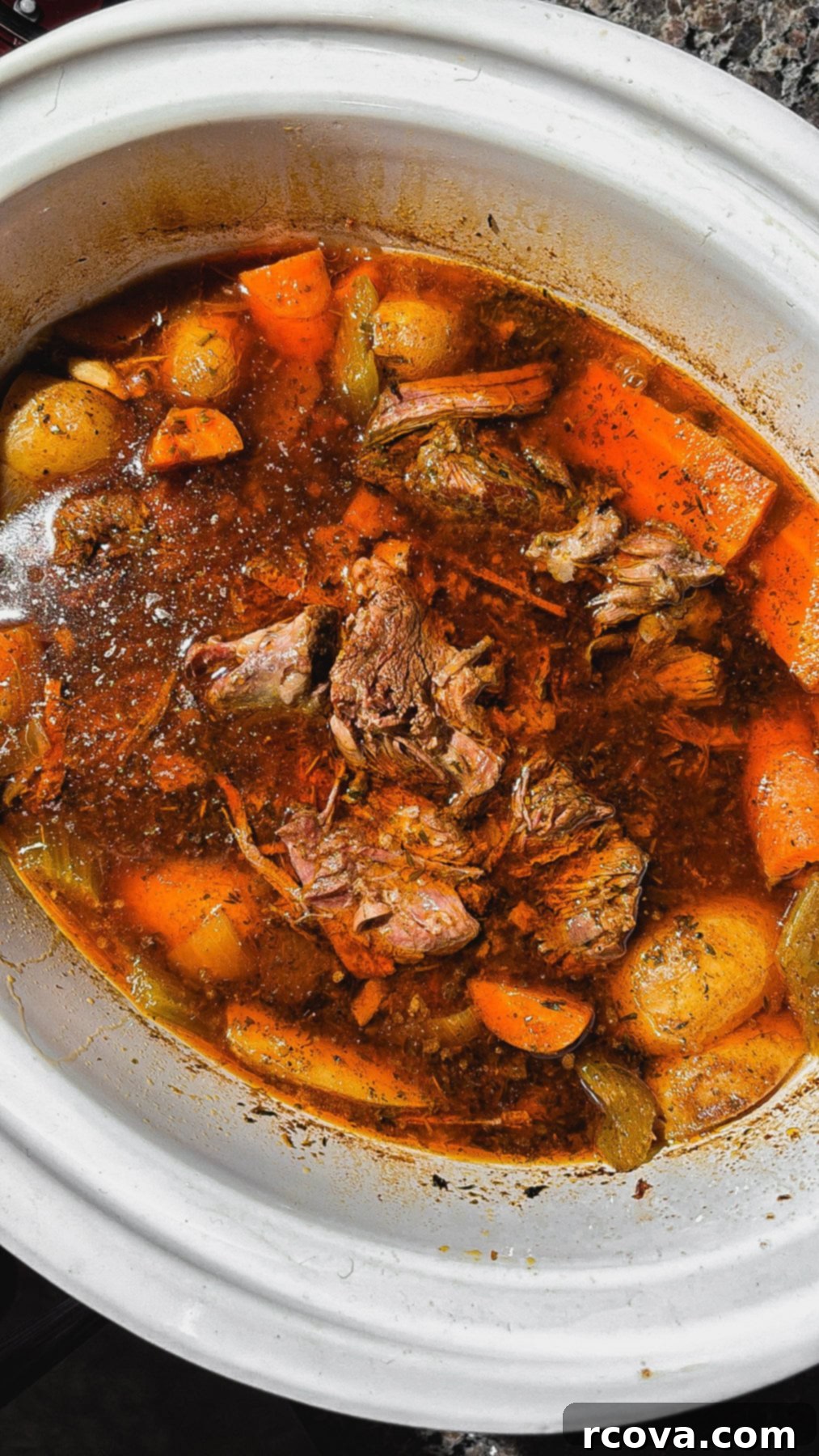 Set-It-and-Forget-It Slow Cooker Pot Roast 4 Close-up of shredded pot roast with gravy