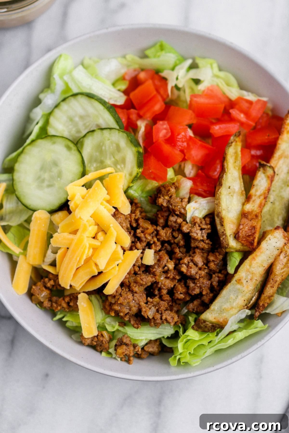 Signature Drizzle Cheesy Burger Bowls 4 Overhead view of several burger bowls ready to serve
