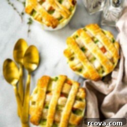 Bite-Sized Chicken Pot Pie Bliss 8 Super Easy Mini Chicken Pot Pies with a golden-brown, flaky crust.