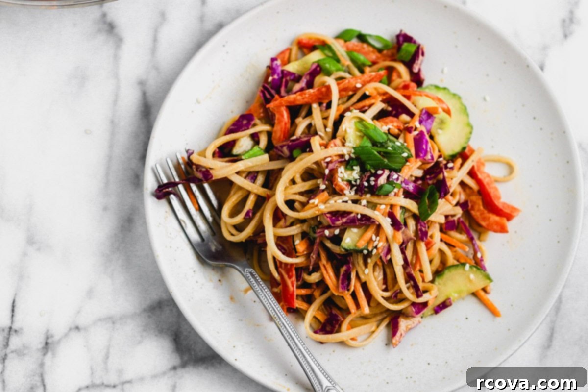 Gluten Free Sesame Rice Noodle Salad 7 top-down view of cold sesame noodle salad in a bowl with chopsticks