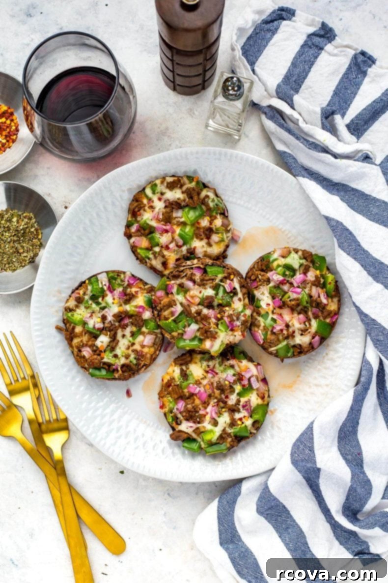 Effortless Low Carb Portobello Pizza Caps 7 Close-up of a Portobello mushroom pizza on a wooden board, with a knife and fresh basil