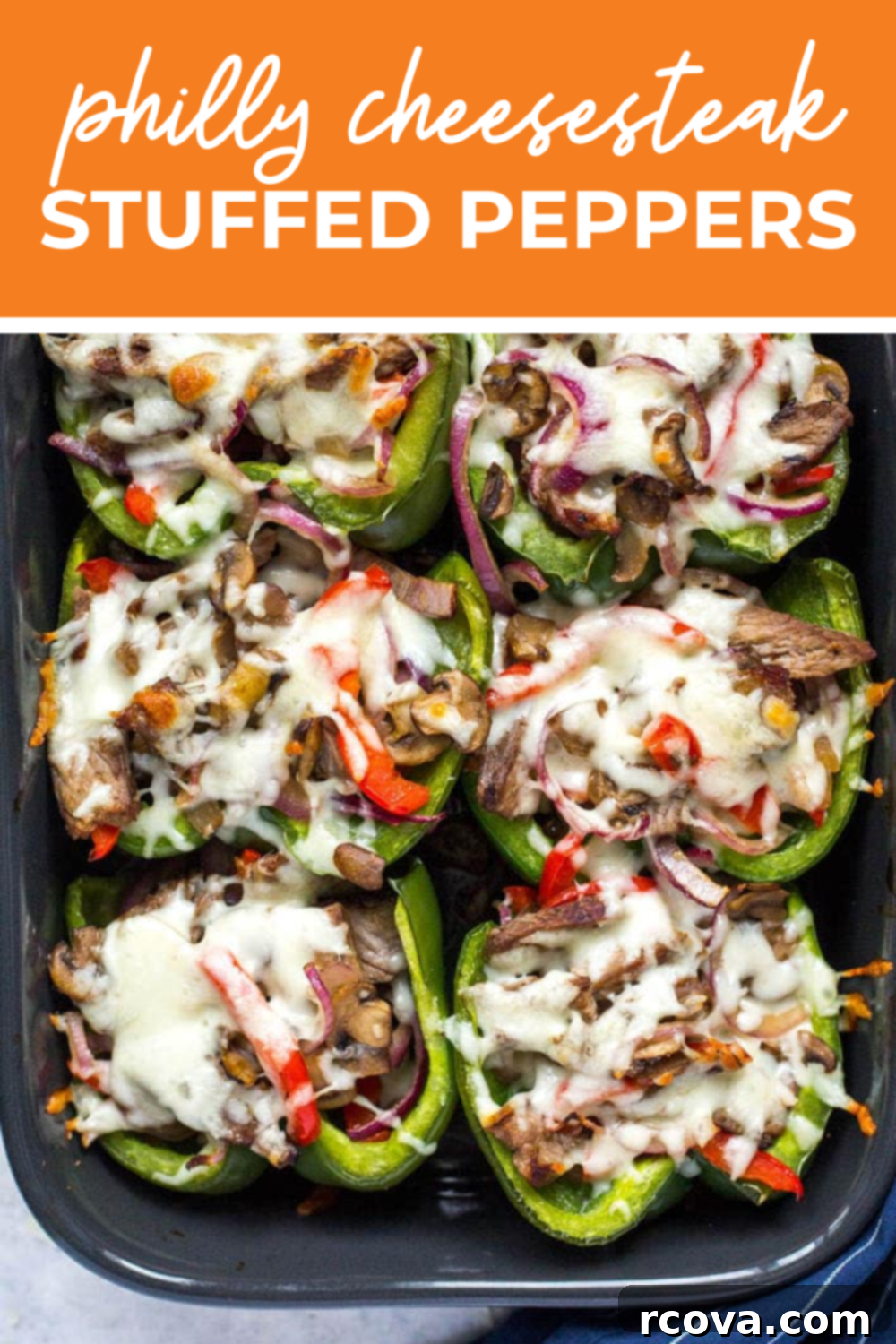 Low Carb Philly Cheesesteak Stuffed Peppers 8 Philly cheesesteak stuffed peppers in a black casserole dish with the text "Philly Cheesesteak Stuffed Peppers" on top.