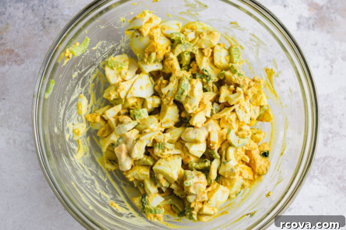 Zesty Celery and Pickle Juice Egg Salad 4 Ingredients for egg salad: hard-boiled eggs, celery, green onion, dill, and a bowl of dressing.