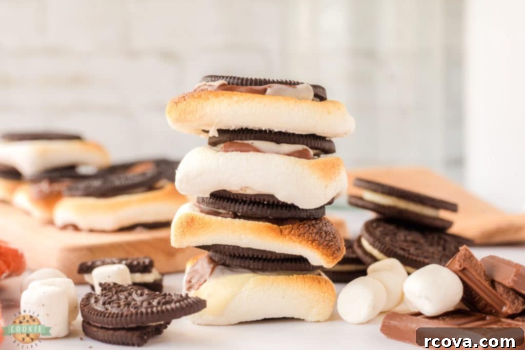 Ultimate Oreo S'mores 2 Stack of Oreo s'mores, showing gooey marshmallow and melted chocolate between cookies.