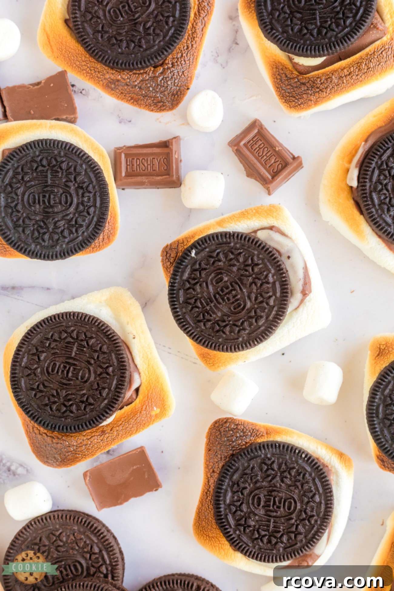 Ultimate Oreo S'mores 8 Oreo cookies with perfectly toasted marshmallows inside, ready to be eaten.