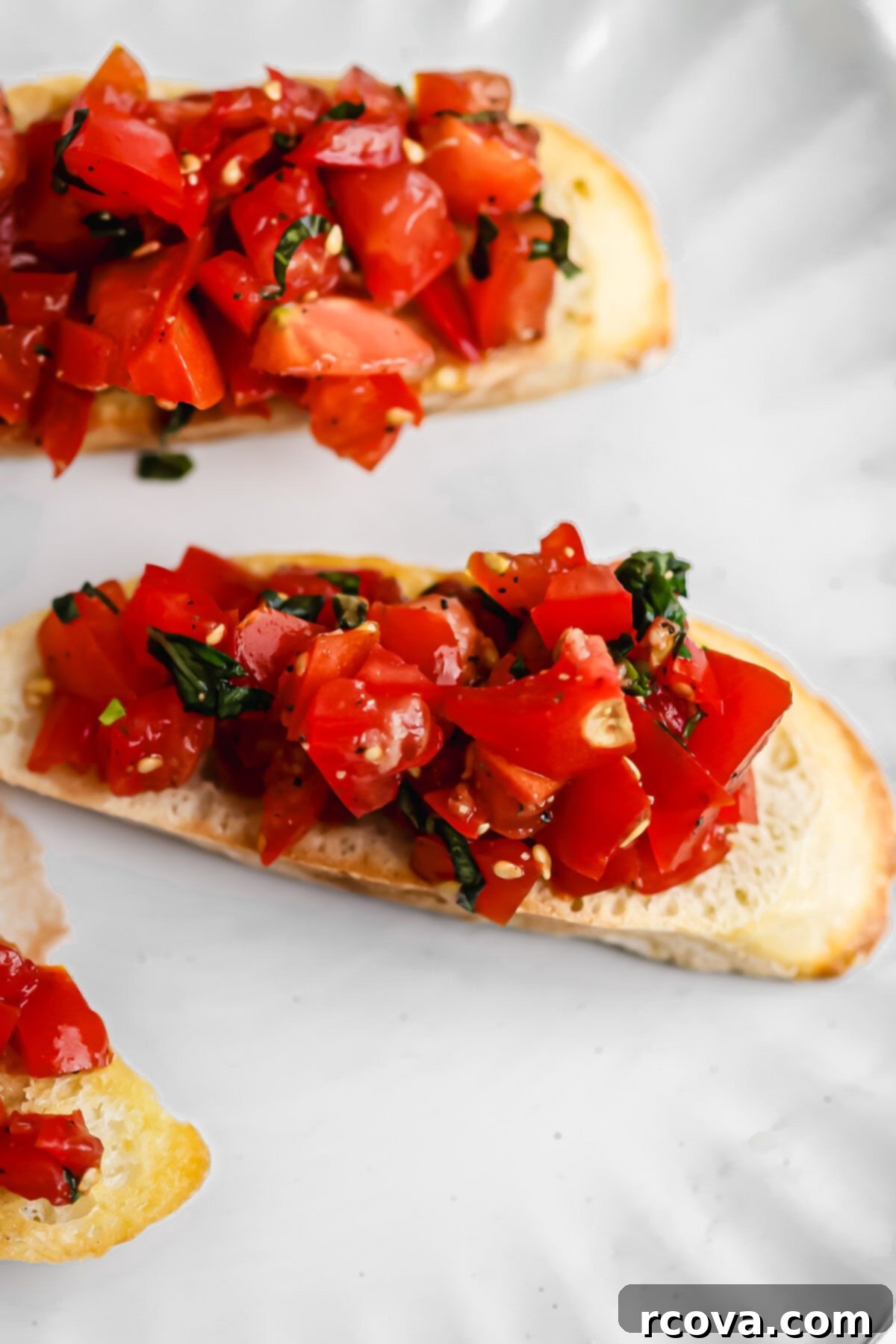 Homemade Bruschetta with a Burst of Grape and Cocktail Tomatoes 4 A bowl of vibrant homemade bruschetta topping ready to be served