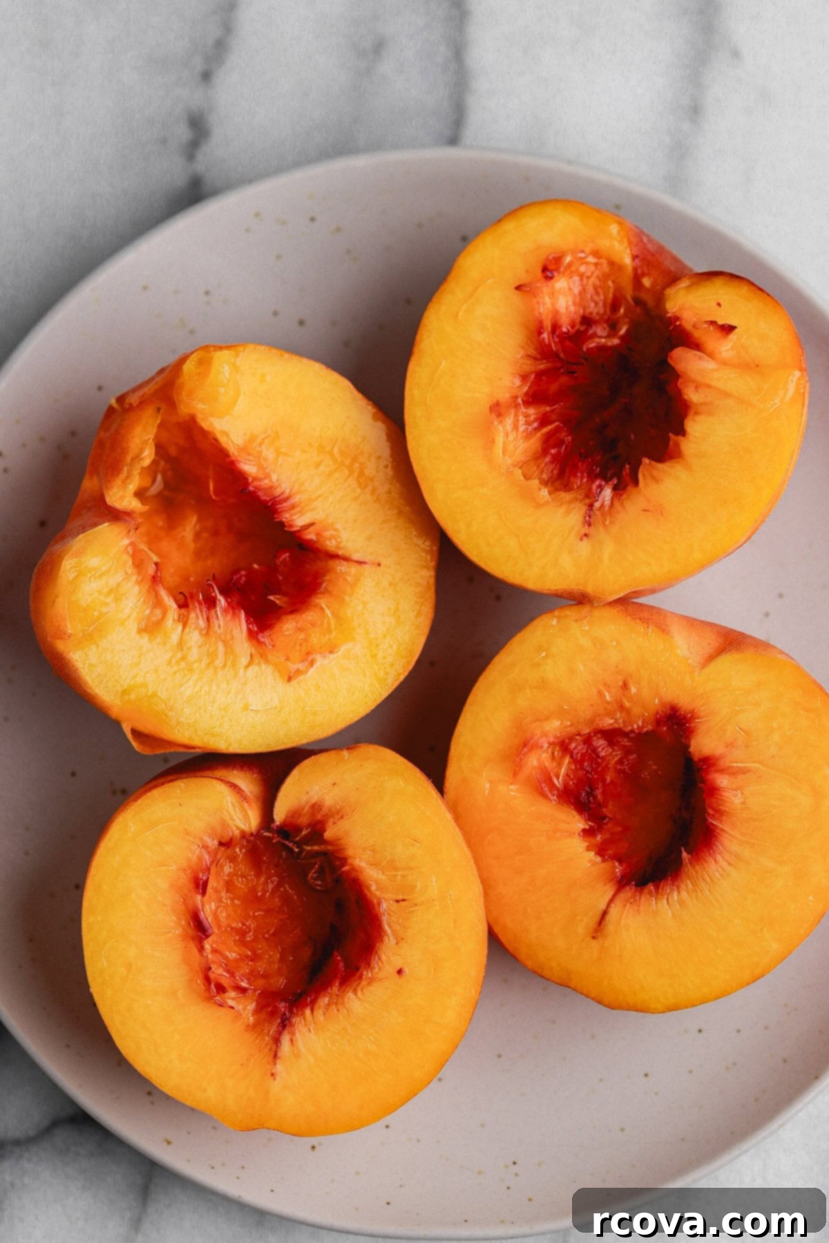 Air Fryer Peaches Simply Sweet and Speedy 3 Close-up of a perfectly caramelized air fryer peach half, showing its juicy interior.