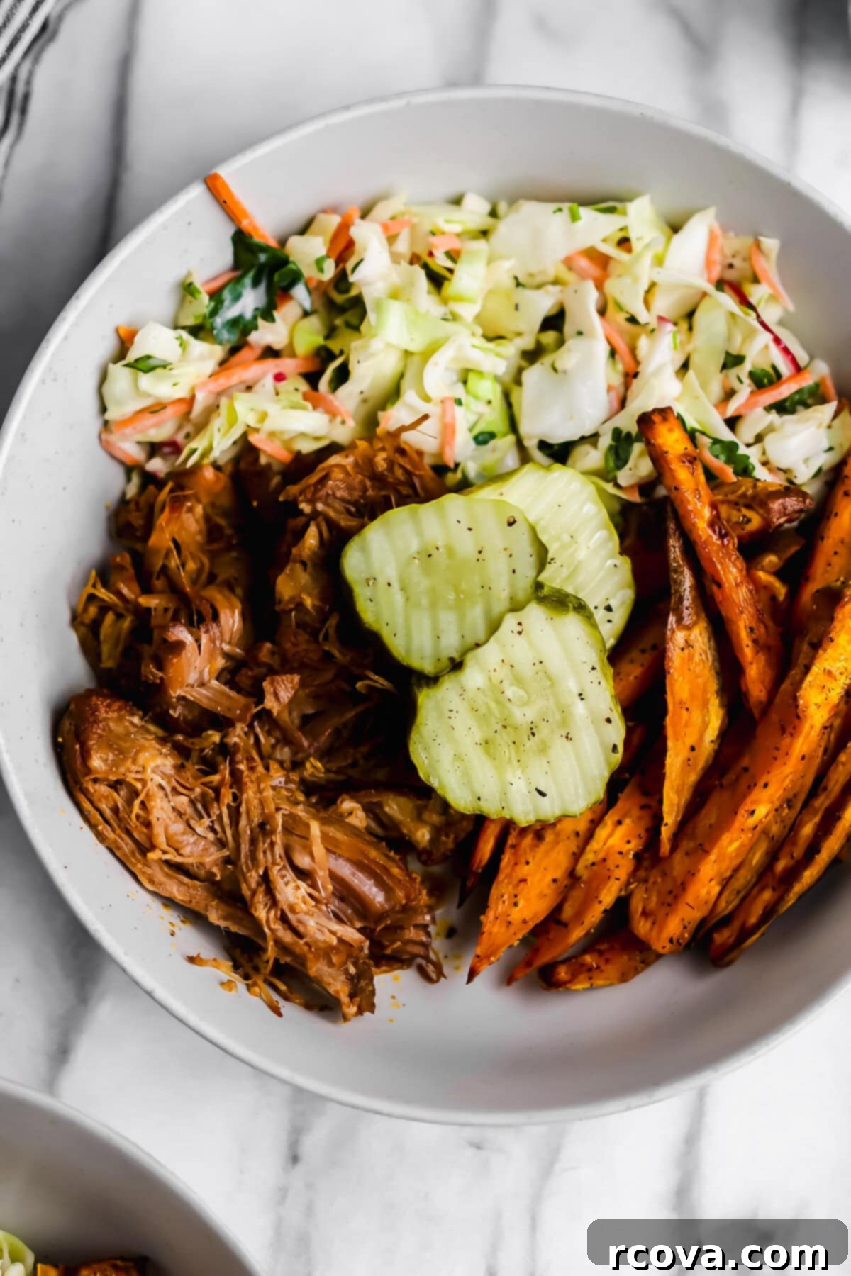 Effortless Sugar-Free Slow Cooker Pulled Pork 4 Shredded pulled pork in the slow cooker, ready to be served.