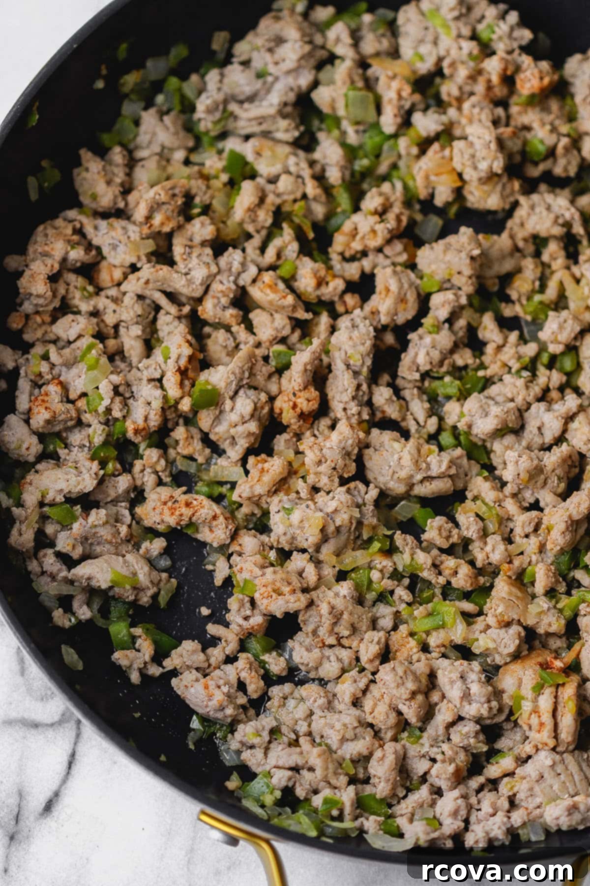 Easy Turkey Sloppy Janes 5 Sautéing onion, bell pepper and garlic in a skillet