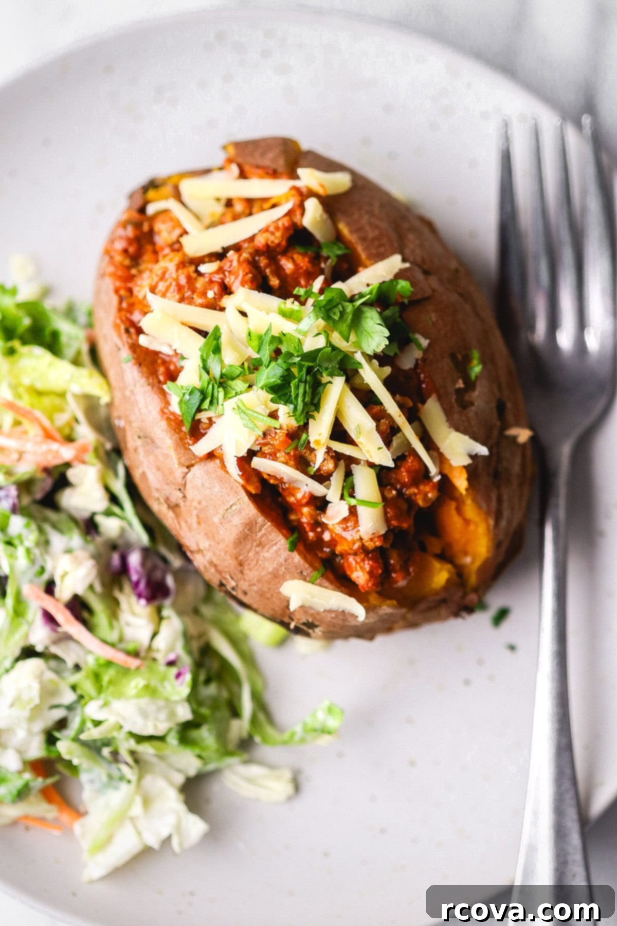 Easy Turkey Sloppy Janes 8 Sloppy jane mix stuffed into a baked sweet potato, topped with cheese and a side salad