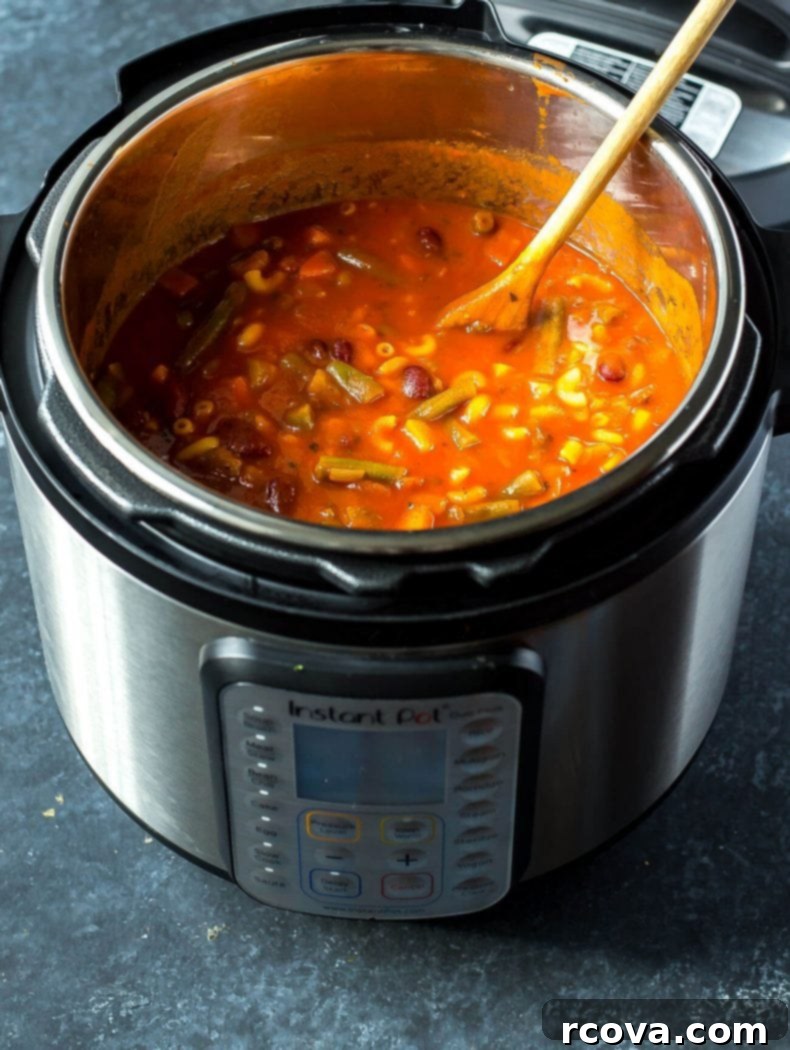 Hearty Instant Pot Minestrone 6 Two bowls of Super Easy Instant Pot Minestrone Soup on a rustic wooden table