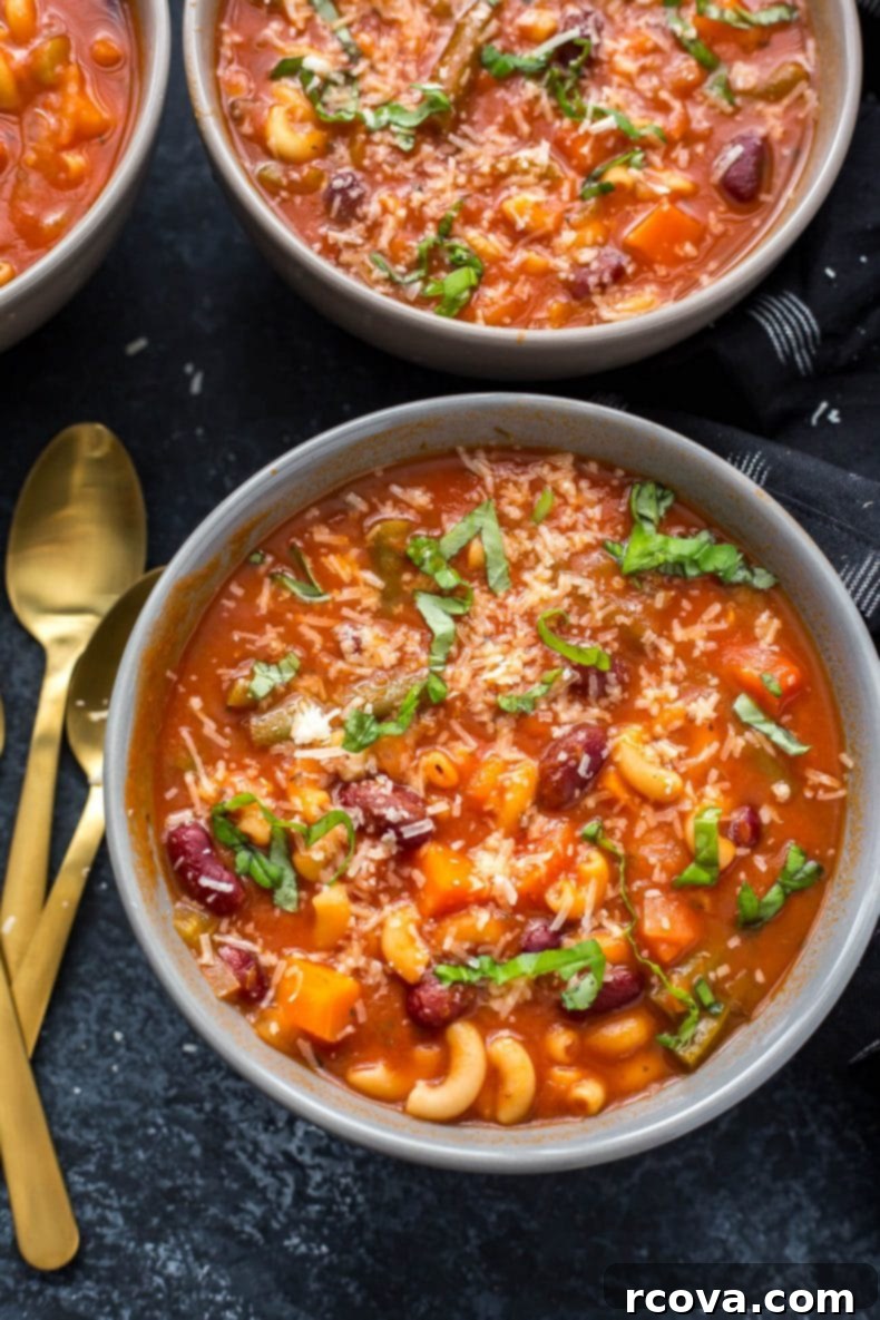 Hearty Instant Pot Minestrone 7 A close-up of a bowl of Instant Pot Minestrone Soup with a spoon